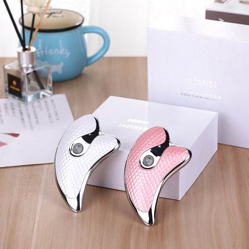 Gua Sha Facial Ultrasonic beauty instrument in silvery white and pink with anion and V type import features.